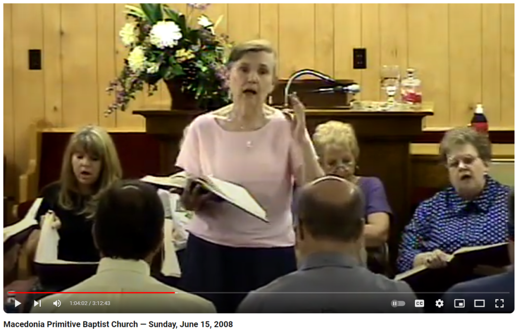 Mary Wright leading a song.